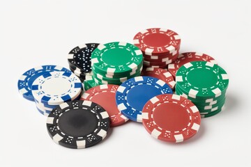A casual spread of assorted colorful poker chips on a clean white surface, offering a playful vibe