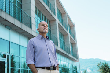 Senior businessman thinking about future of the world and climat