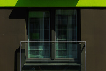 Elements of architectural decorations of buildings, modern windows, walls and balconies.