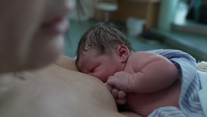 Intimate First Moments/ Newborn Infant Breastfeeding Right After Birth, Focused on Mother-Child...