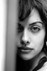 Monochrome head-shot of young woman looking at camera.