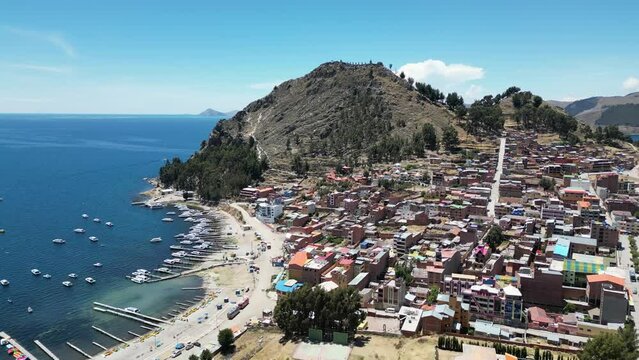 Aerial video over the town of Copacabana on the shoreline of Lake Titicaca, Bolivia