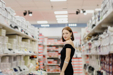 woman in clothing and shoe store shopping