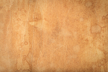 A brown paper with a few stains on it