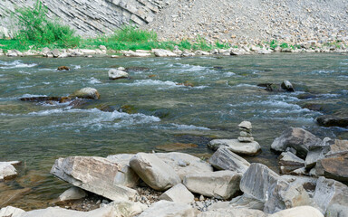 beautiful mountain river flowing through rocks and forest