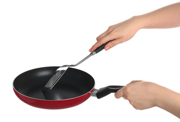 Woman with spatula and frying pan on white background, closeup