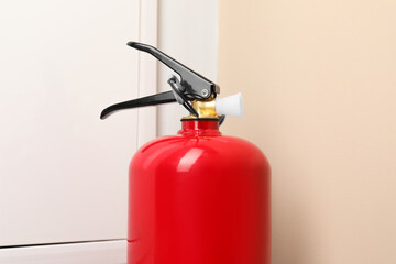 Obraz premium One fire extinguisher indoors, closeup. Safety equipment