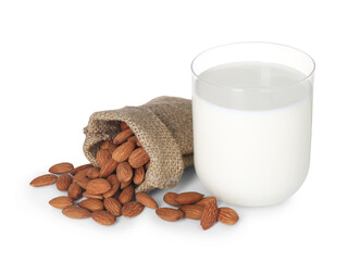 Glass of almond milk and almonds isolated on white