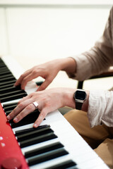 Obraz premium Music school. Playing the piano. Hands on keyboard