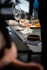 Wine tasting. Sommelier pours wine into a glass