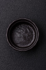 Beautiful empty white ceramic gravy boat on a concrete background