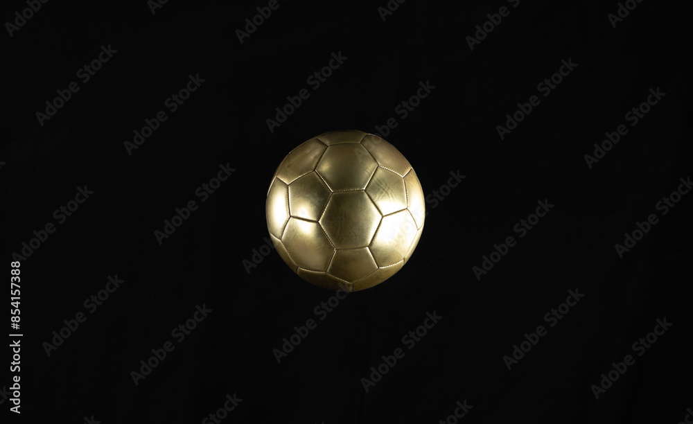 Poster soccer golden ball isolated on black background