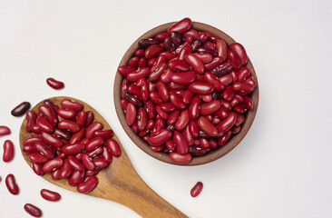 Raw red beans in a plate on the table, top view.