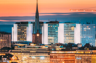 Stockholm, Sweden. View Of St. Clara Or Saint Klara Church And Houses In Twilight Dusk Lights....