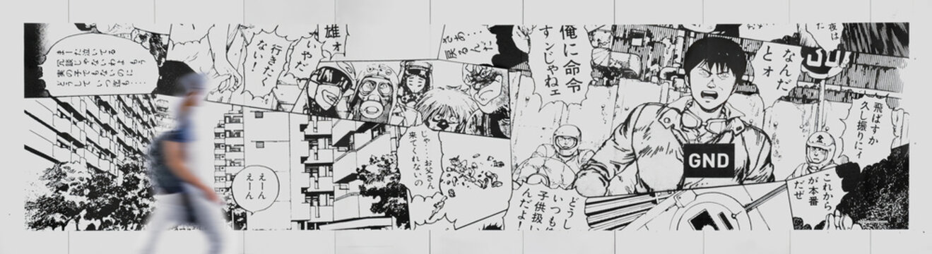 tokyo, shibuya - nov 11 2017: Temporary wall during the construction of Parco Mall with a fresco by artist Kosuke Kawamura featuring a collage of illustrations from the manga Akira by Katsuhiro Otomo.