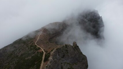 Fototapeta premium madeira cloudy mountain peeks from drone