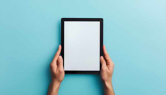 Human hands holding digital tablet with a white blank screen