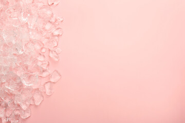 Pieces of crushed ice on pink background, top view. Space for text