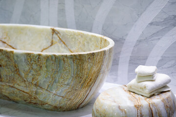 freestanding tub in natural stone finish bathroom