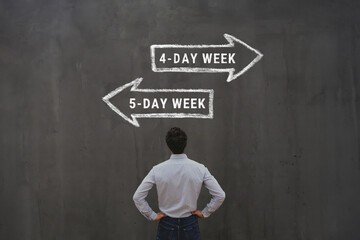 4-day work week vs 5 day workweek concept with business man looking at arrows signs,  five-day week or four-day, friday off