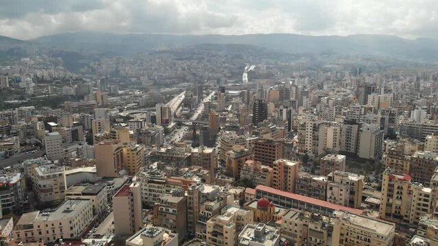 Aerial View of Beirut, Lebanon, Showing Cityscape and Green Space on a Sunny Day