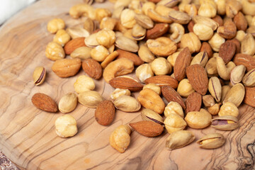 Mixed nuts on wooden background