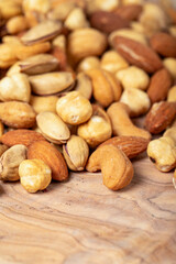 Mixed nuts on wooden background. Close up