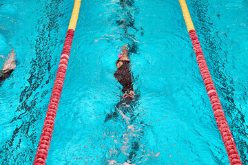 Finswimming World Championships. Aquatics monofin underwater sports. Athletes competing in blue...