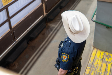 Faceless Texas policeman in cowboy hat top view