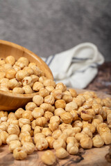 Hazelnuts on wood background. Roasted hazelnuts in a bowl