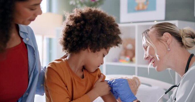 Child, pediatrician and mother for clinic consultation with plaster bandage for injection, immunization or patient care. Woman, boy and parent for medical assessment or insurance, wellness or happy