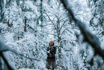 person in winter forest