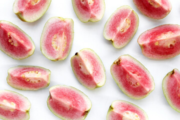 Fresh pink guava on white background.
