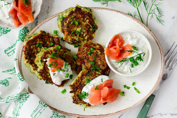 Zucchini pancakes with sour cream, smoked salmon and dill sauce.top veiw