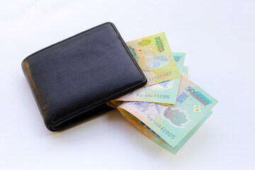 Vietnamese dong banknotes on yellow background.