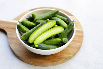 Mini cucumbers on white background.