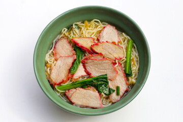 Chinese egg noodles with red pork in hot soup