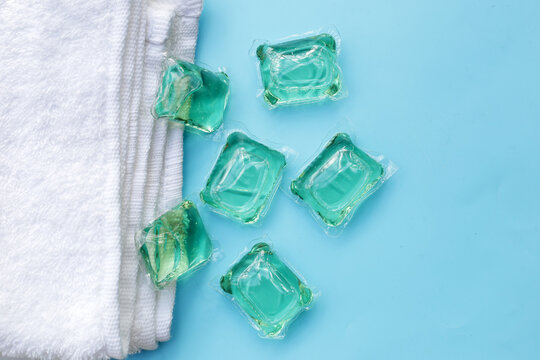 Towel with gel ball laundry detergent, detergent capsule pods