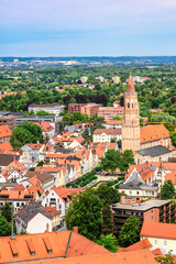 Obraz premium Panoramic view, aerial skyline of Landshut in Bavaria. Saint Martin cathedral, Martinskirch in old town and cathedrals, architecture, roofs of houses, streets landscape, Landshut, Germany. Vertical