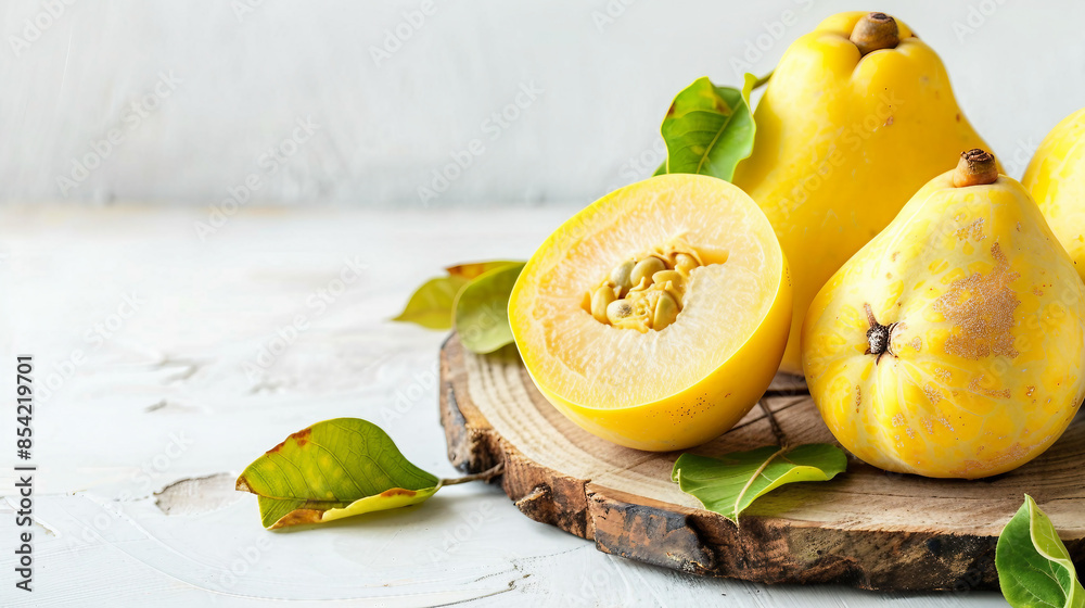 Wall mural Fresh Quince Fruit on Wooden Chopping Board for Healthy Cooking Stock Photo