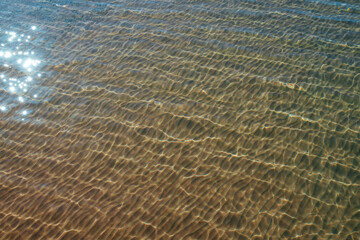 Surface of sea water with sun glare