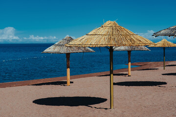 Umbrellas on sea beach on summer day