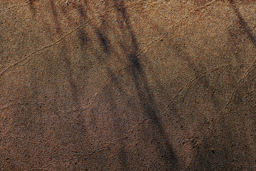 Sand on beach with shadows abstract texture or background