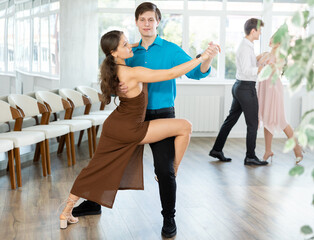 Fototapeta premium Tango performed by young couple in a choreographic studio