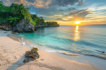 Golden sunset illuminating turquoise ocean water on tropical beach