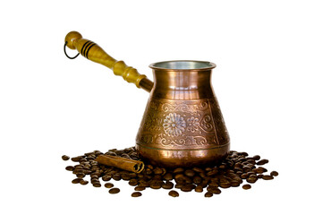 Copper coffee pot and scattered coffee beans.