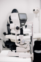 The concept of new ophthalmological and modern technologies, diagnostics and vision treatment. Interior of a modern ophthalmology clinic with modern equipment.