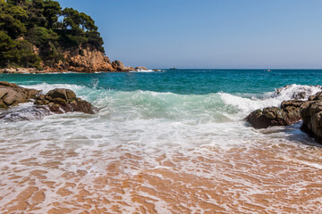 beach in Cala Sa Boadella Bay, Costa Brava, Lloret de Mar, Catalonia, Spain. Beautiful seascape. huge waves