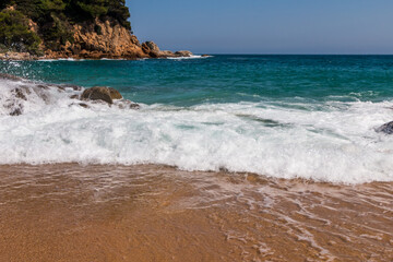 beach in Cala Sa Boadella Bay, Costa Brava, Lloret de Mar, Catalonia, Spain. Beautiful seascape. huge waves