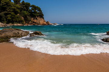 Obraz premium beach in Cala Sa Boadella Bay, Costa Brava, Lloret de Mar, Catalonia, Spain. Beautiful seascape. huge waves